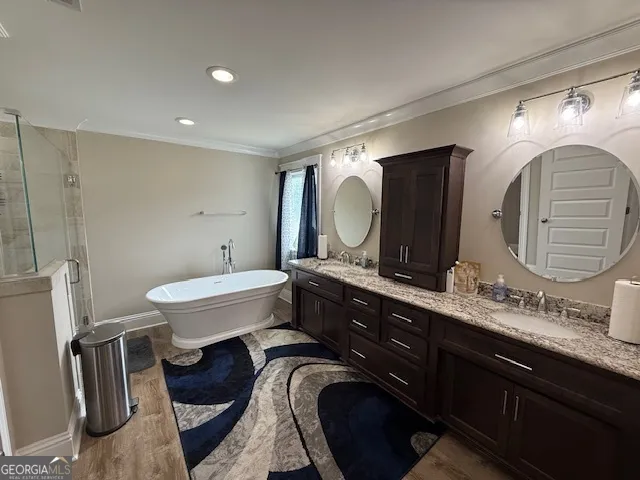 a spacious bathroom with a double vanity sink and a mirror