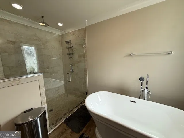 a bathroom with a sink a toilet a mirror and shower