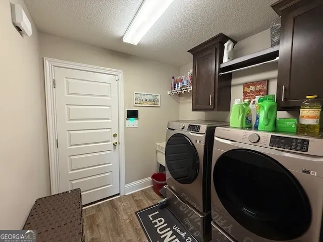 a view of livingroom with washer and dryer