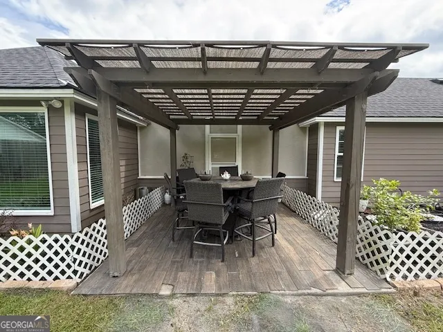 a view of a patio with table and chairs