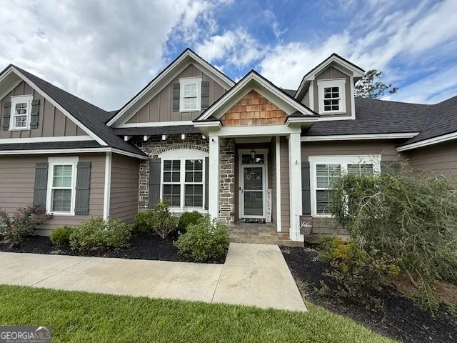 a front view of a house with garden