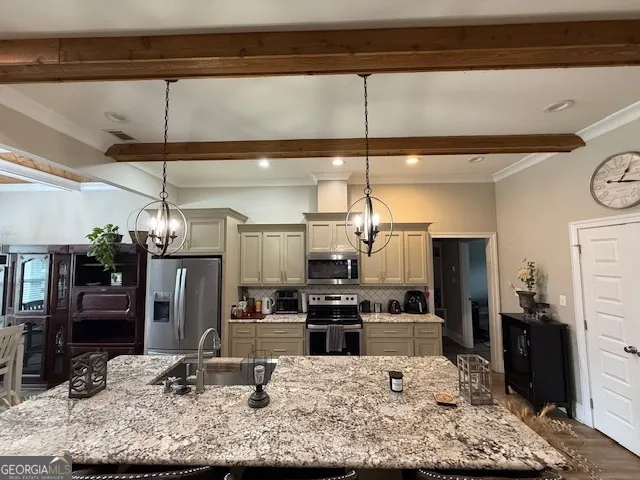 a kitchen with stainless steel appliances kitchen island granite countertop a refrigerator