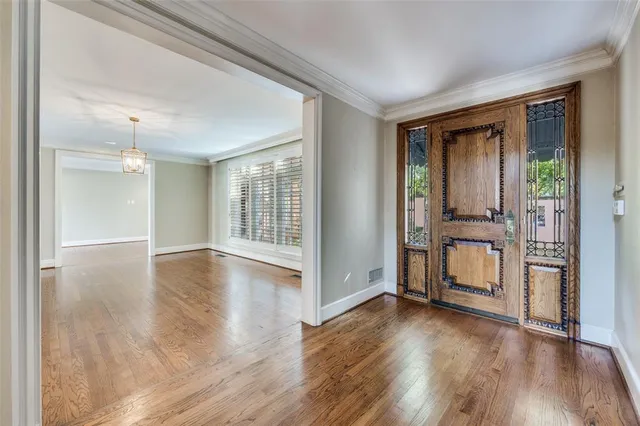 a view of an entryway with wooden floor