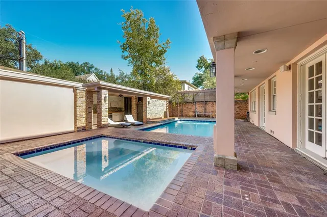 a view of swimming pool with a patio