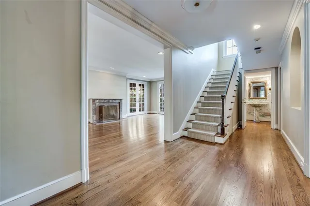 a view of a room with wooden floor and stairs