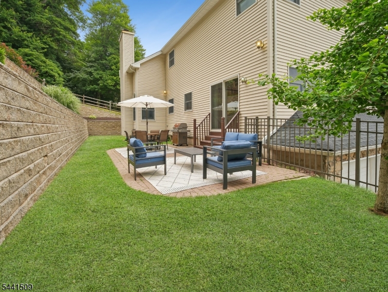 610 River Road Chatham, NJ 07928 - Photo 33 of 42 a view of a backyard with sitting area