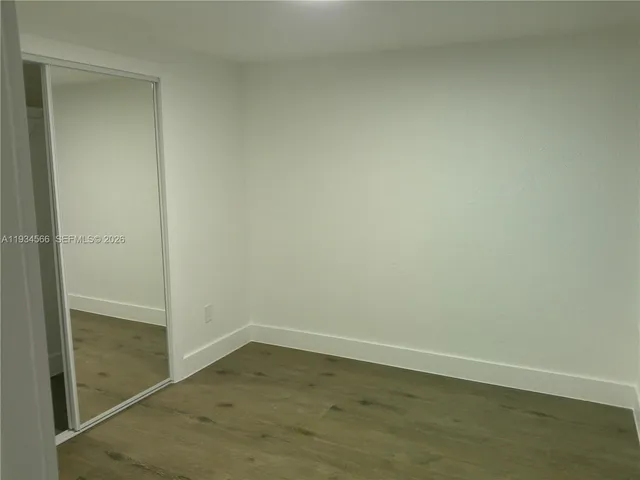 an empty room and wooden floor