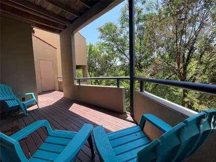 a view of deck with wooden floor and outdoor seating