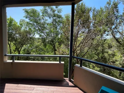 a view of a balcony with mountain view