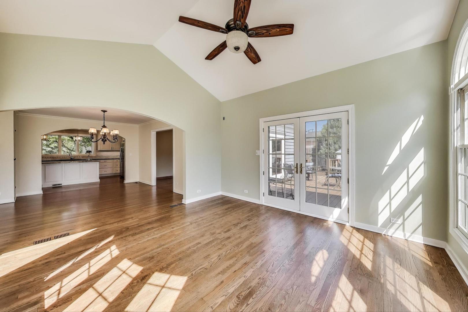 455 Sunset Ridge Road Northfield, IL 60093 - Photo 13 of 47 a view of an empty room with wooden floor and a window
