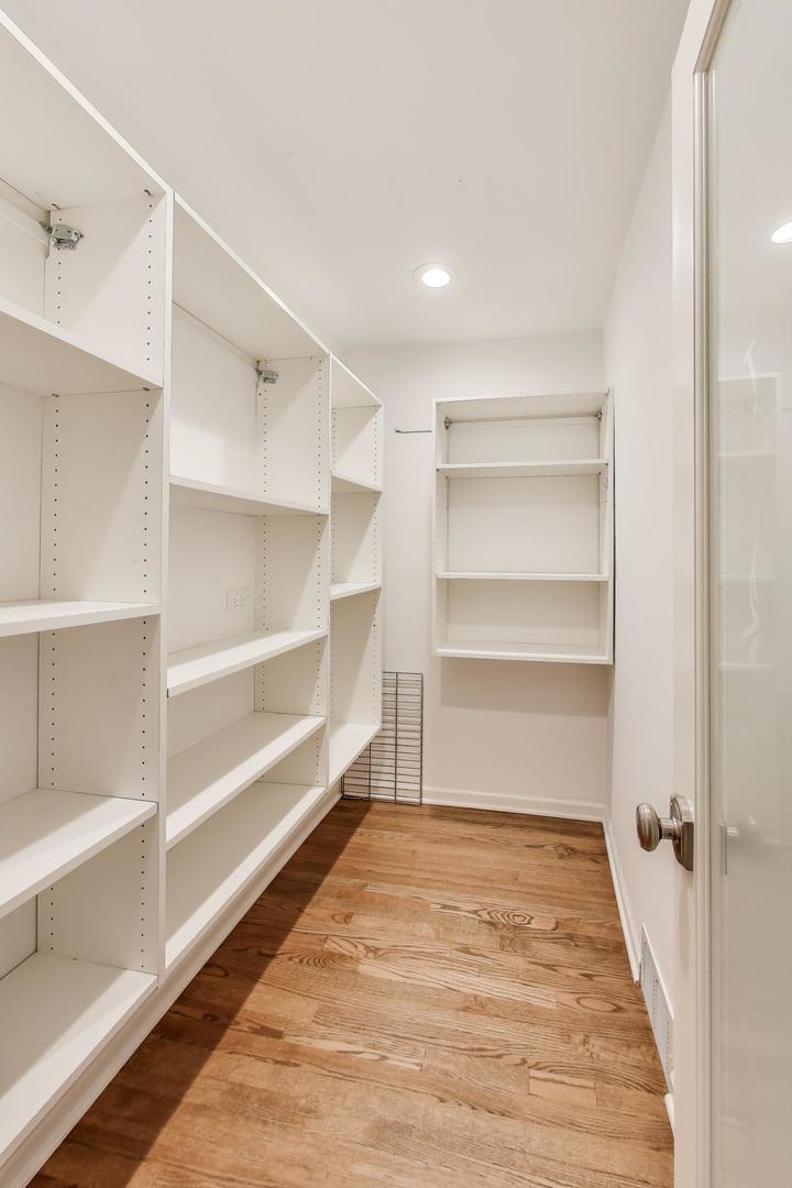 455 Sunset Ridge Road Northfield, IL 60093 - Photo 18 of 47 a view of a room with a wooden floor