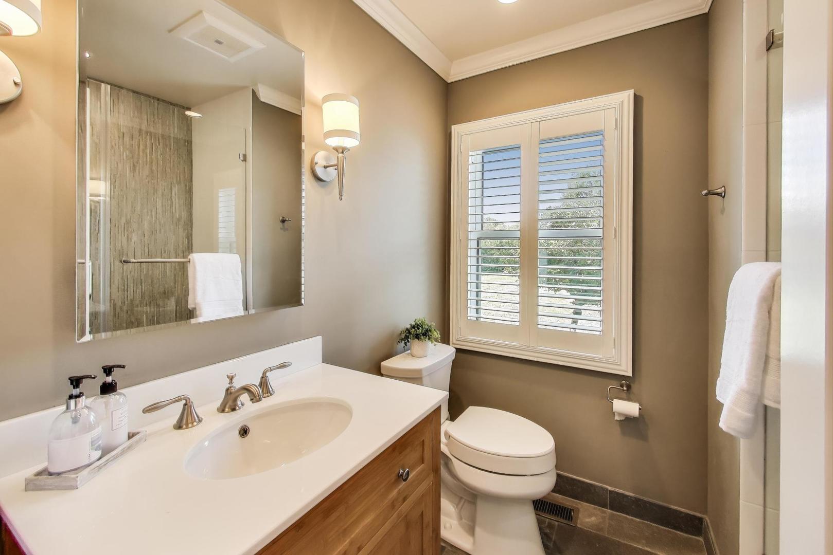 455 Sunset Ridge Road Northfield, IL 60093 - Photo 29 of 47 a bathroom with a sink a toilet and shower