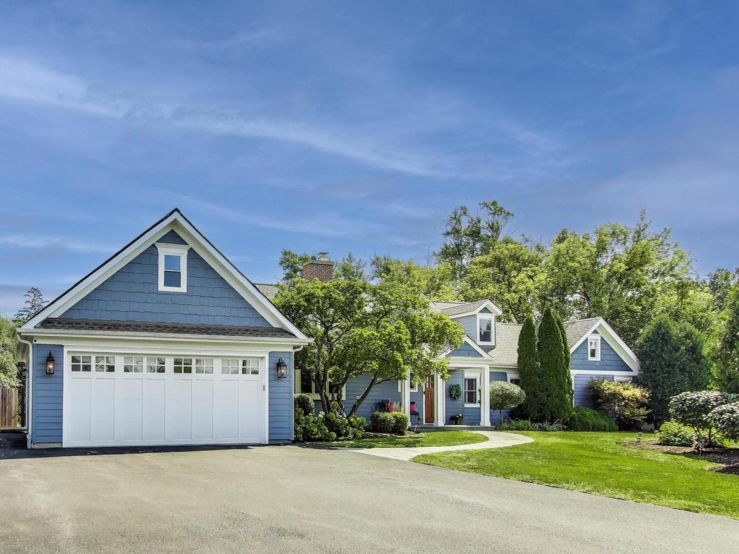 455 Sunset Ridge Road Northfield, IL 60093 - Photo 3 of 47 a front view of a house with a yard and garage