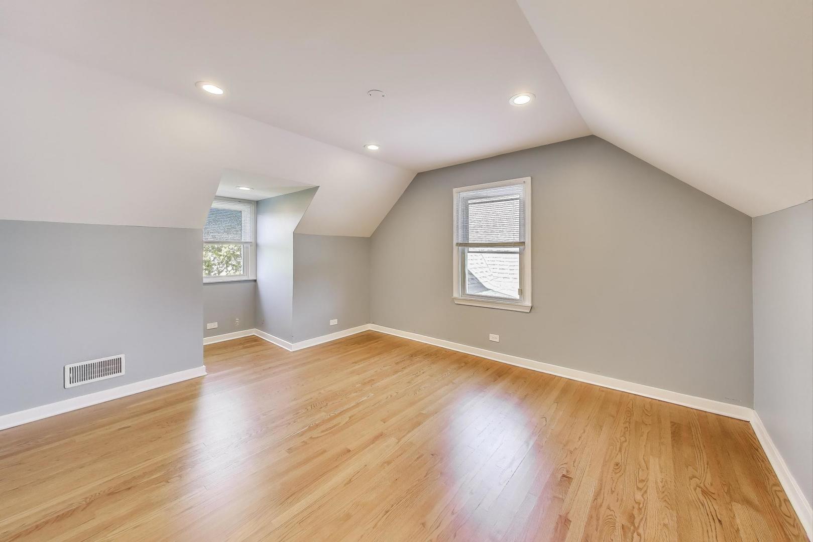 455 Sunset Ridge Road Northfield, IL 60093 - Photo 33 of 47 a view of empty room with wooden floor and fan
