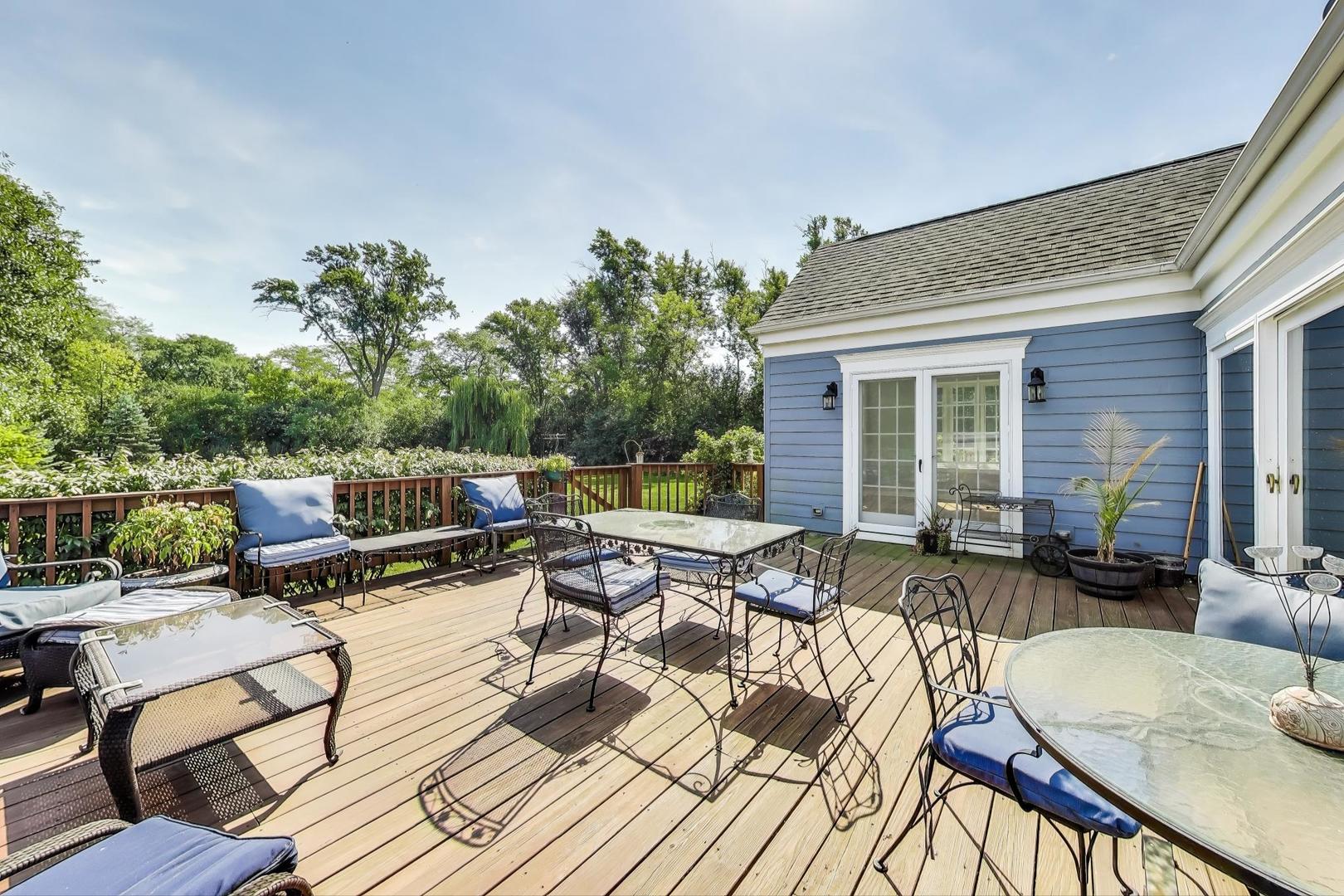 455 Sunset Ridge Road Northfield, IL 60093 - Photo 39 of 47 a roof deck with couches and wooden floor