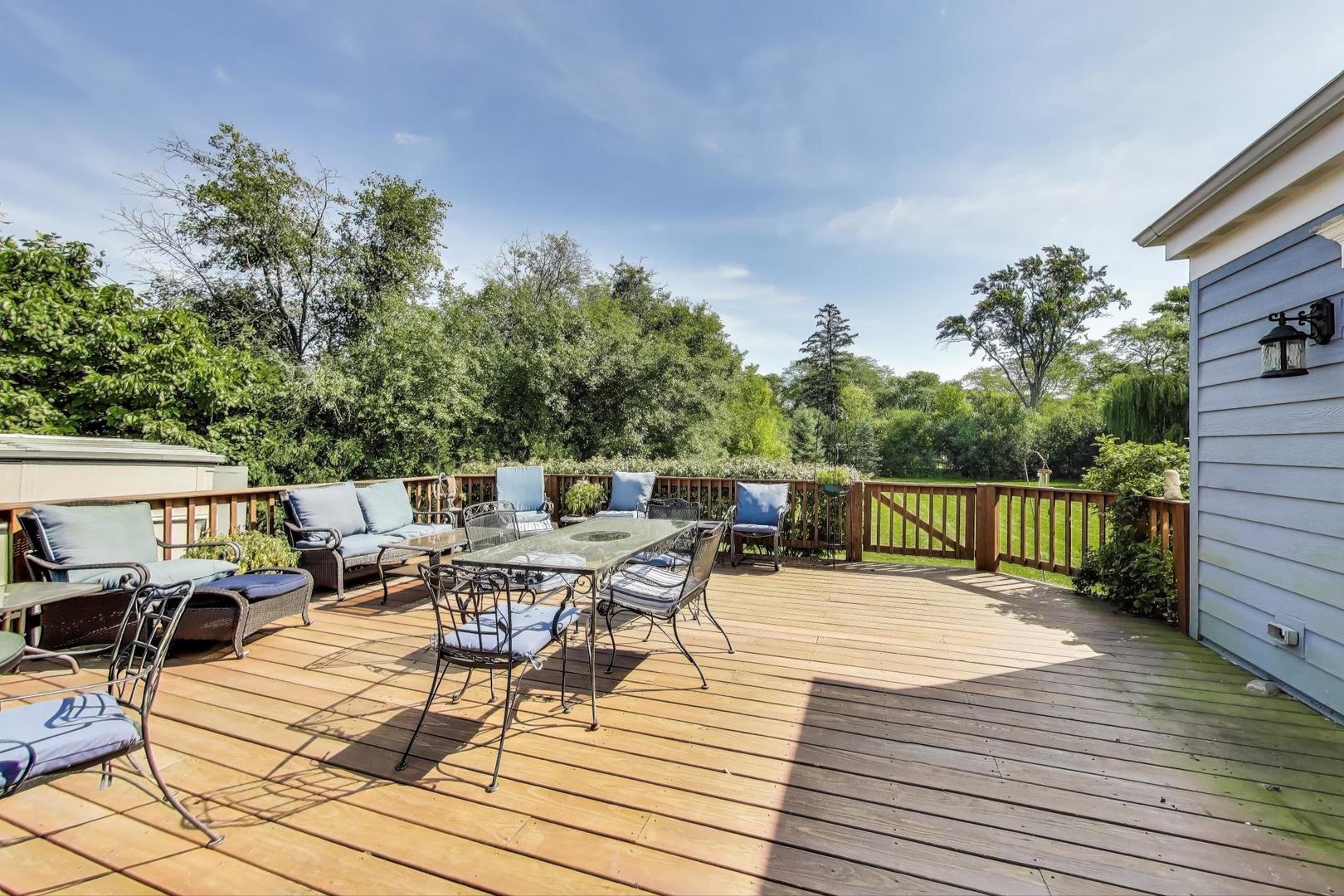 455 Sunset Ridge Road Northfield, IL 60093 - Photo 40 of 47 a balcony with wooden floor table and chairs
