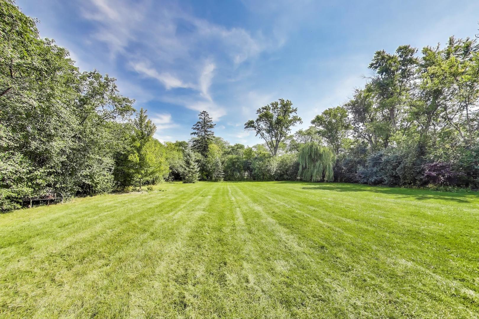 455 Sunset Ridge Road Northfield, IL 60093 - Photo 44 of 47 a view of a big yard with swimming pool and green space