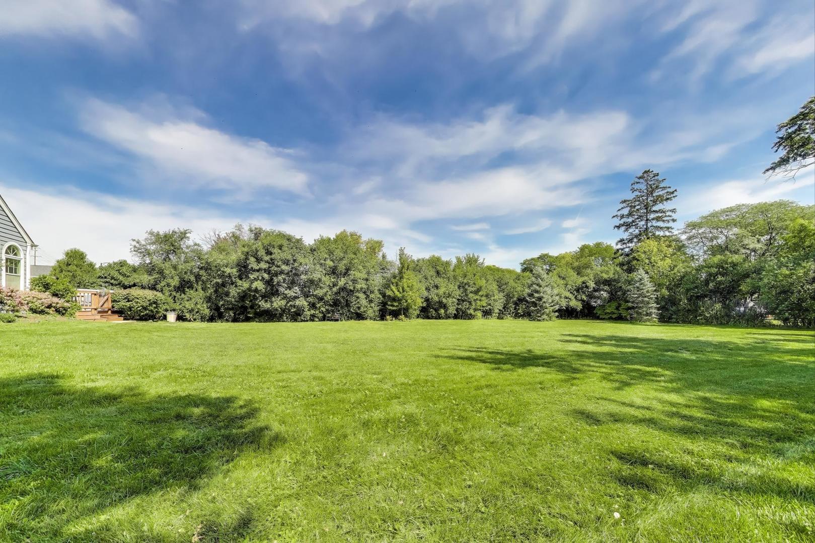 455 Sunset Ridge Road Northfield, IL 60093 - Photo 46 of 47 a view of grassy field with trees in the background