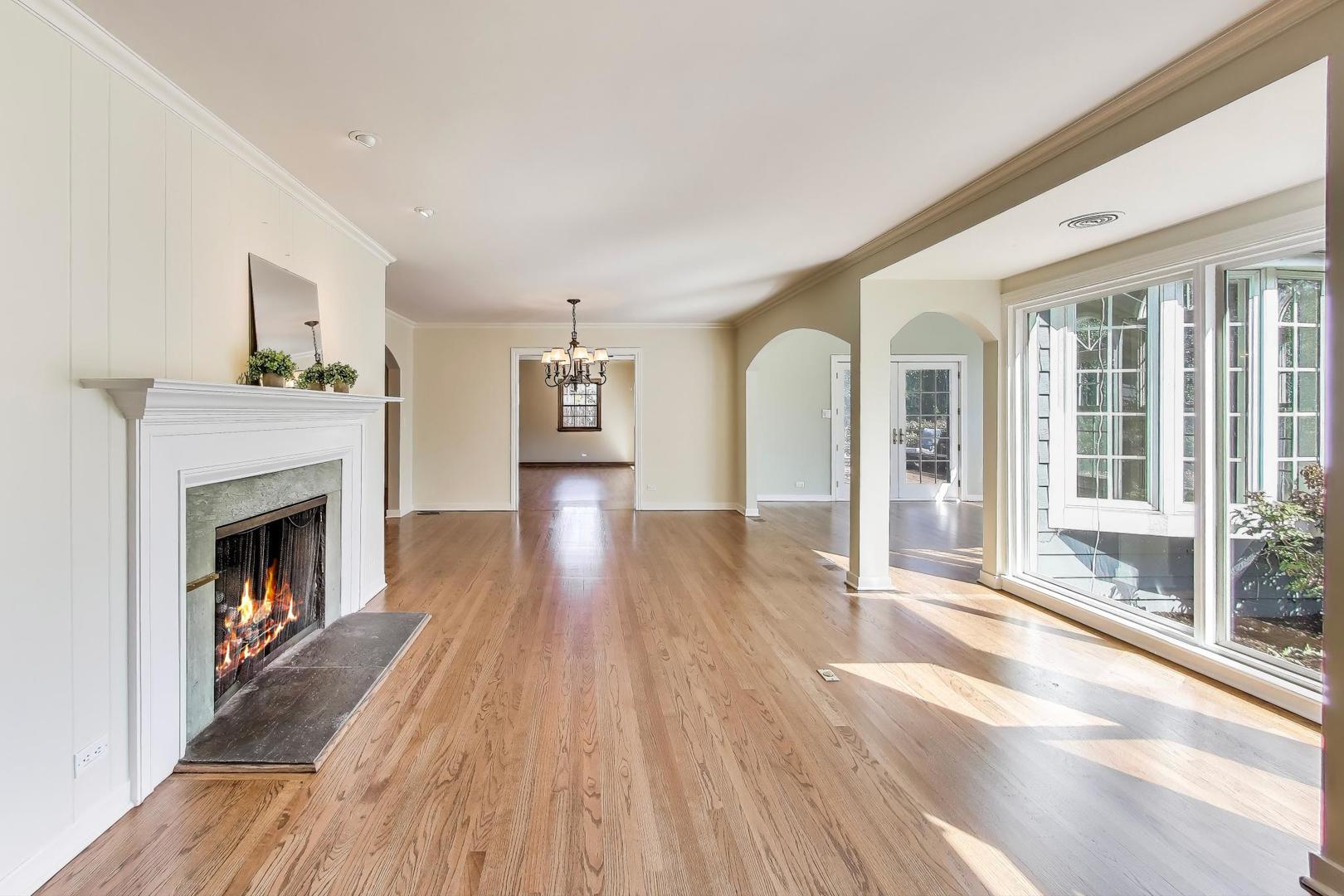 455 Sunset Ridge Road Northfield, IL 60093 - Photo 7 of 47 a living room with furniture and a fireplace
