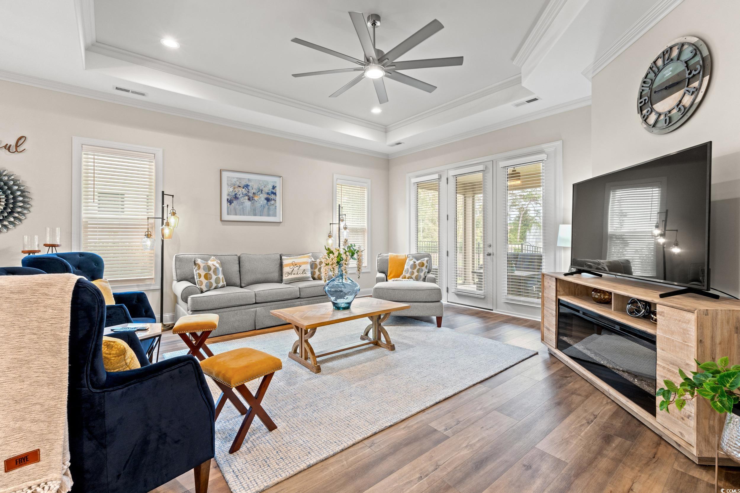 8338 Cape Dutch Loop Myrtle Beach, SC 29572 - Photo 13 of 39 Living room with hardwood / wood-style floors, ornamental molding, ceiling fan, recessed lighting, and a raised ceiling