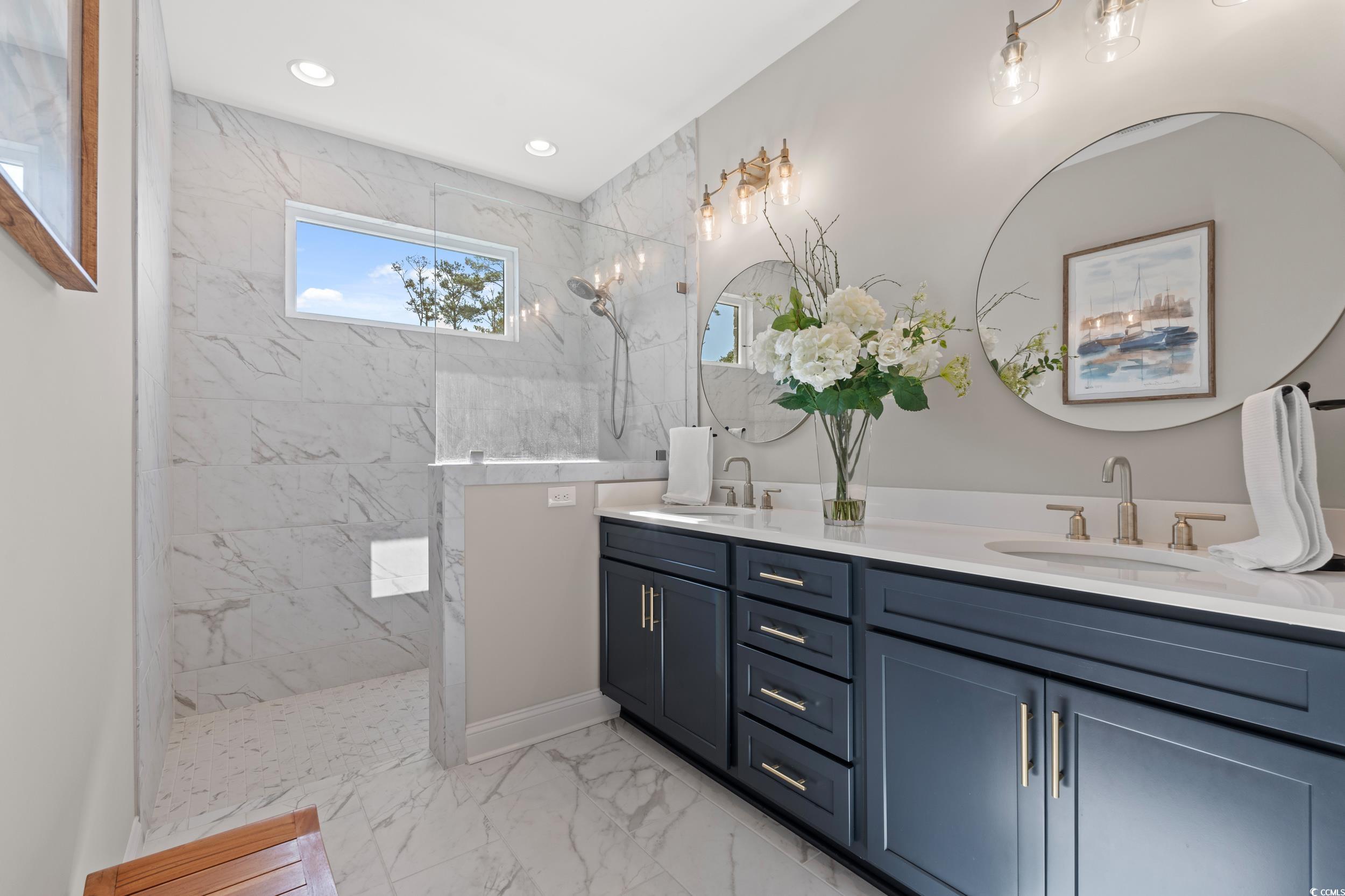8338 Cape Dutch Loop Myrtle Beach, SC 29572 - Photo 18 of 39 Bathroom with a marble finish shower, double vanity, and light marble finish floors