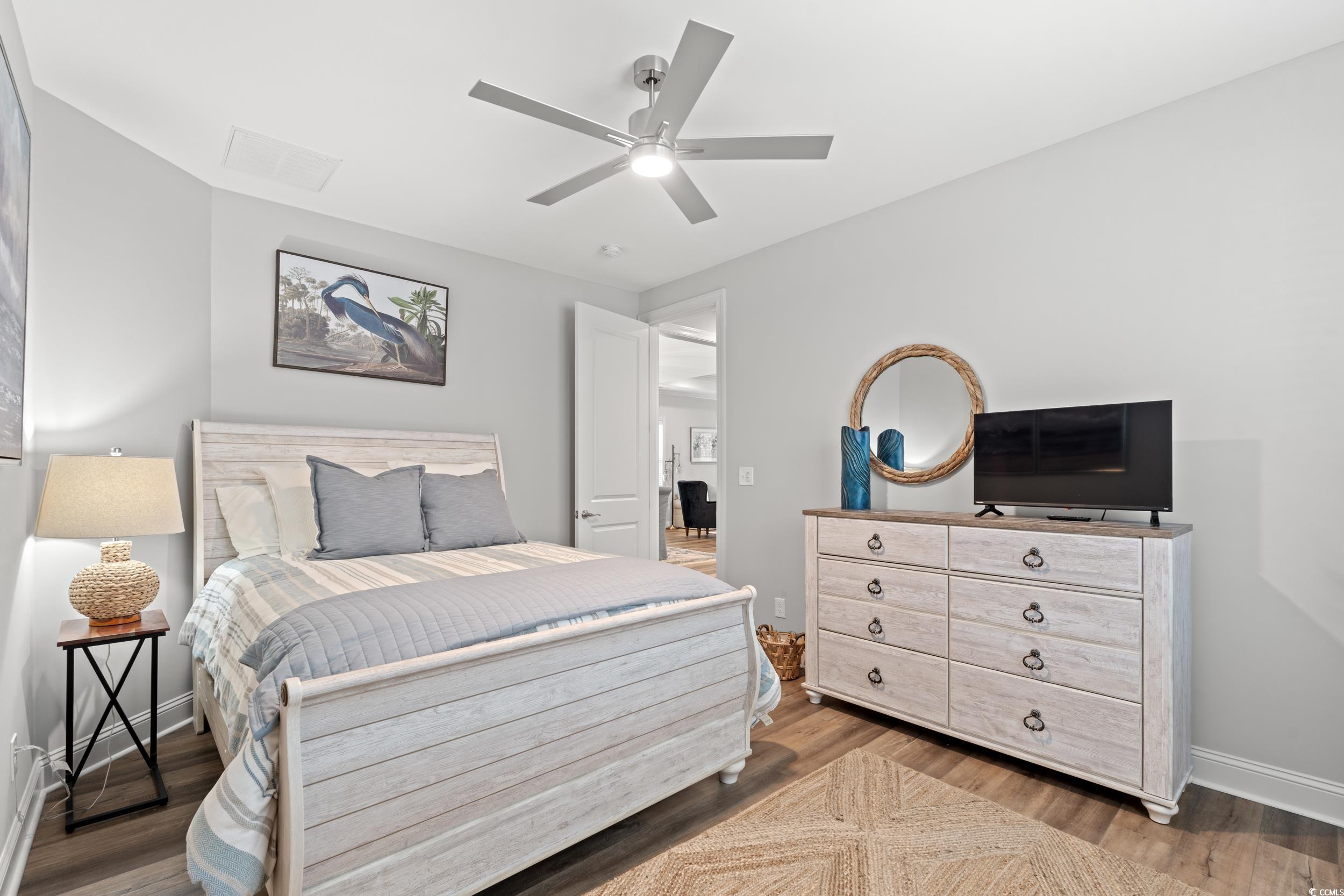 8338 Cape Dutch Loop Myrtle Beach, SC 29572 - Photo 19 of 39 Bedroom featuring ceiling fan and light wood-style flooring