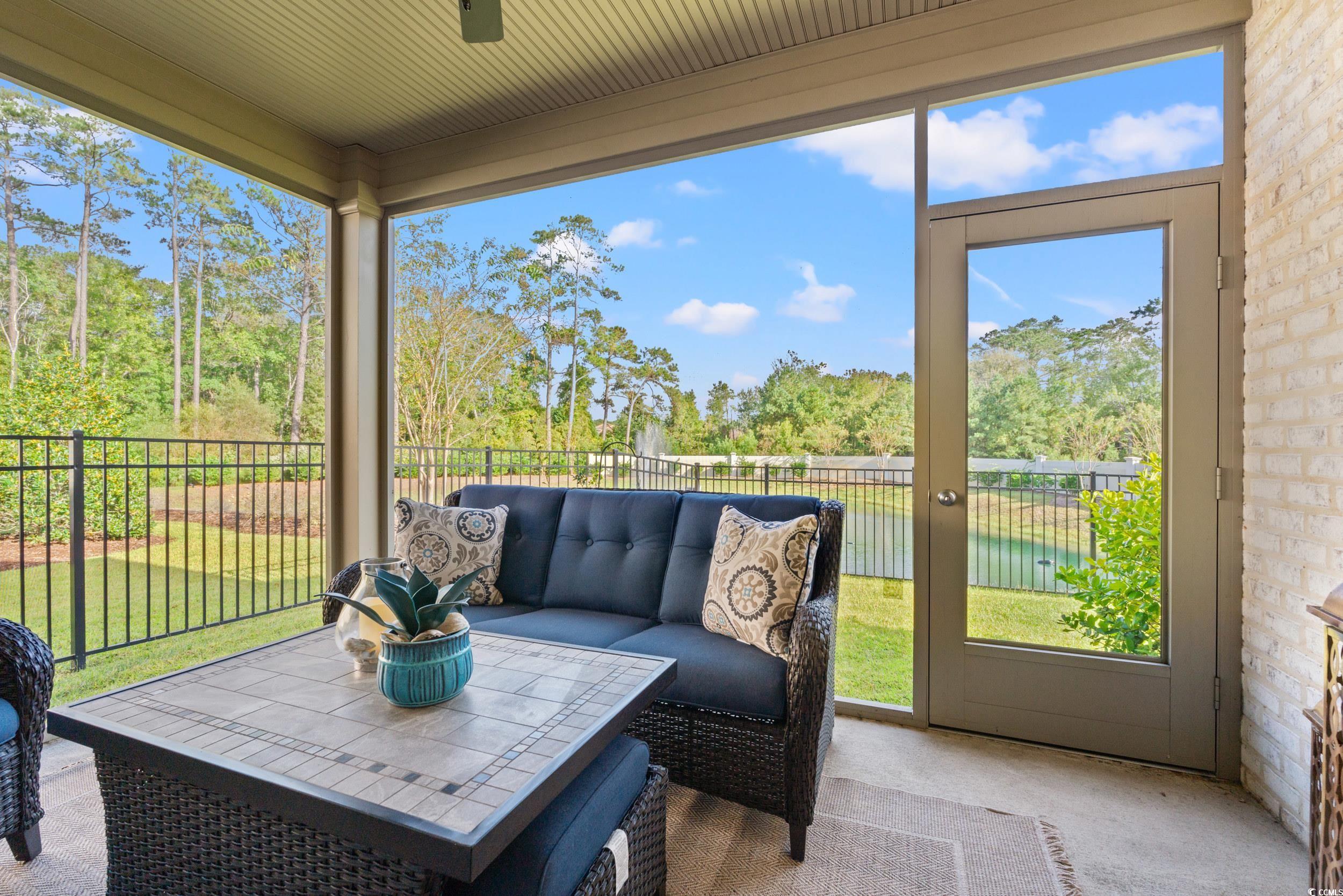 8338 Cape Dutch Loop Myrtle Beach, SC 29572 - Photo 27 of 39 Sunroom / solarium with a water view and view of scattered trees