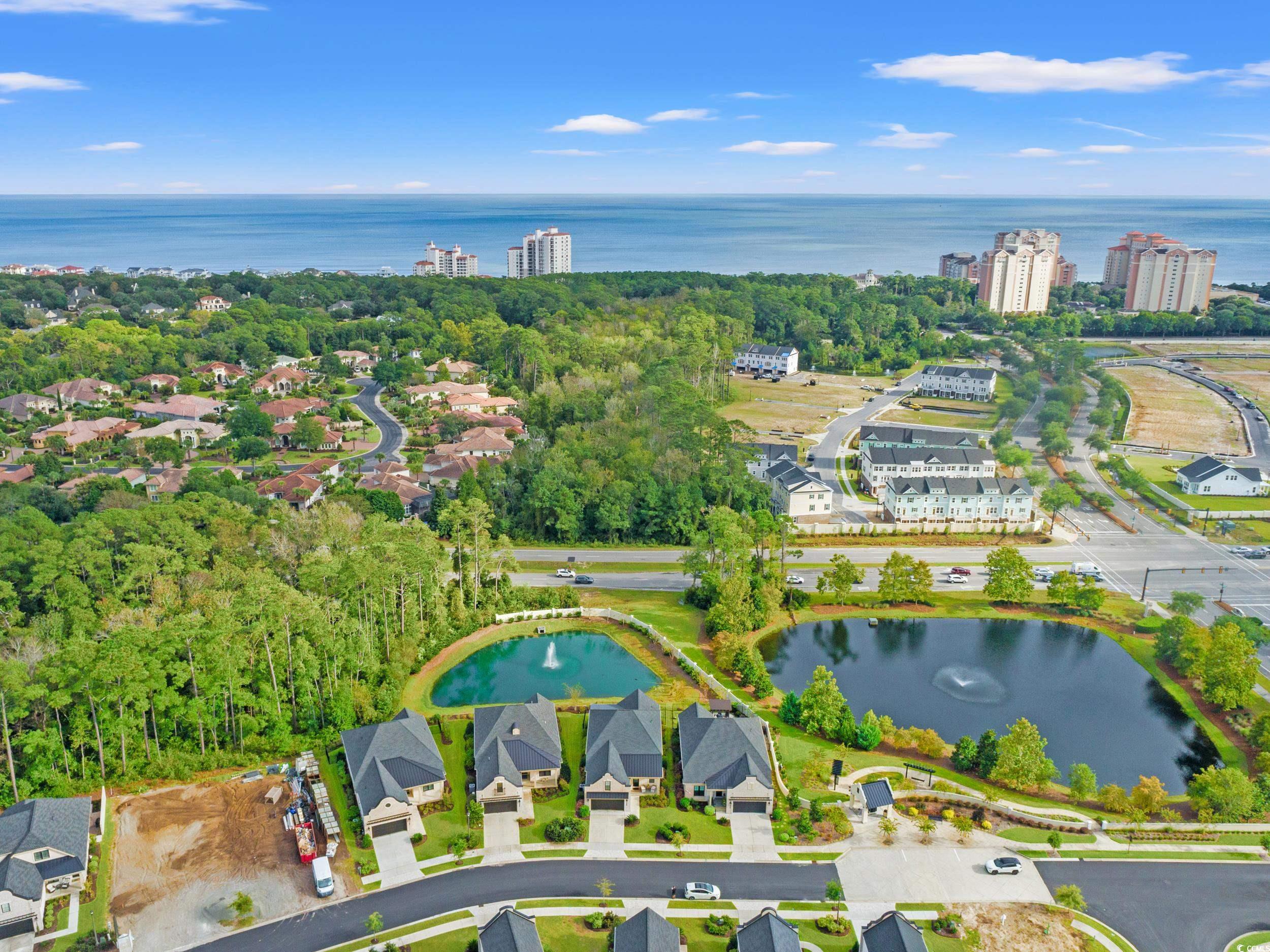 8338 Cape Dutch Loop Myrtle Beach, SC 29572 - Photo 3 of 39 Aerial view of a nearby body of water and a tree filled landscape