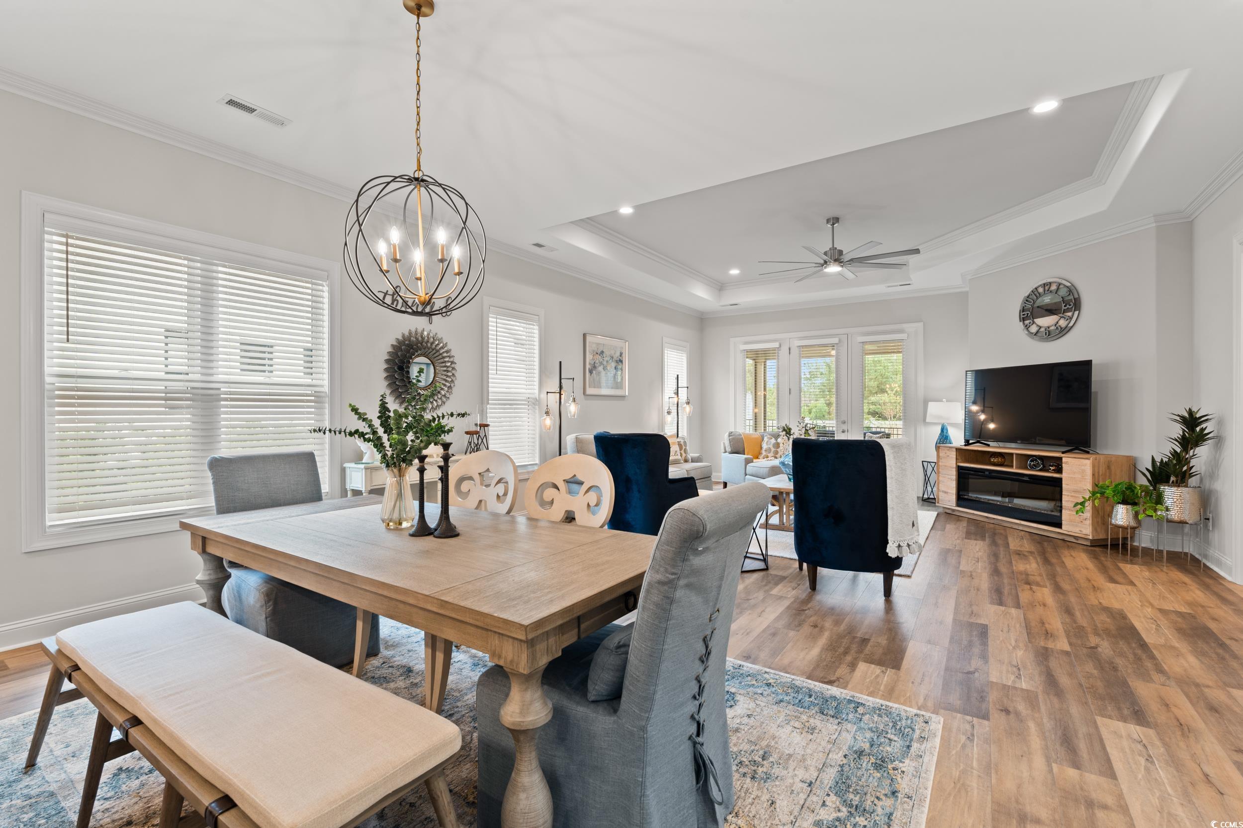 8338 Cape Dutch Loop Myrtle Beach, SC 29572 - Photo 10 of 39 Dining space with ornamental molding, light wood finished floors, ceiling fan, recessed lighting, and a raised ceiling