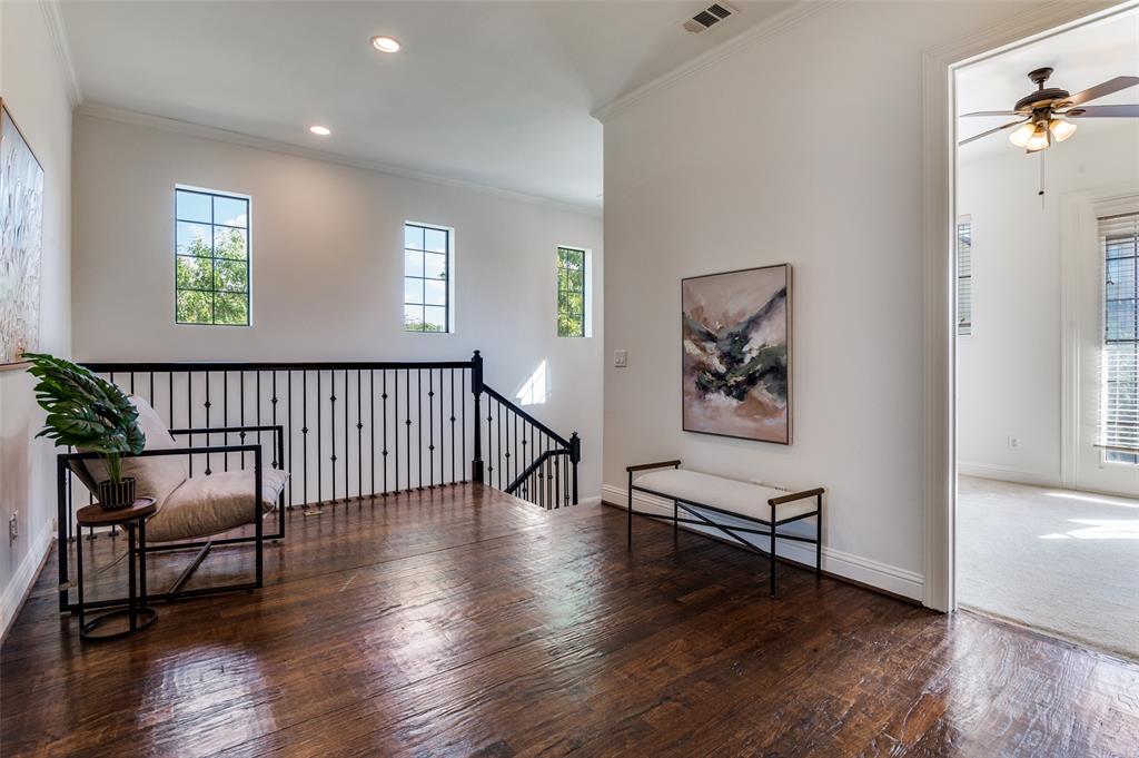 1120 Hemingway Lane Irving, TX 75063 - Photo 12 of 24 a view of a hallway with wooden floor and windows