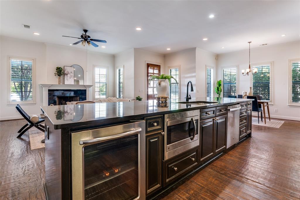 1120 Hemingway Lane Irving, TX 75063 - Photo 6 of 24 a large kitchen with stainless steel appliances granite countertop a stove and a wooden floors