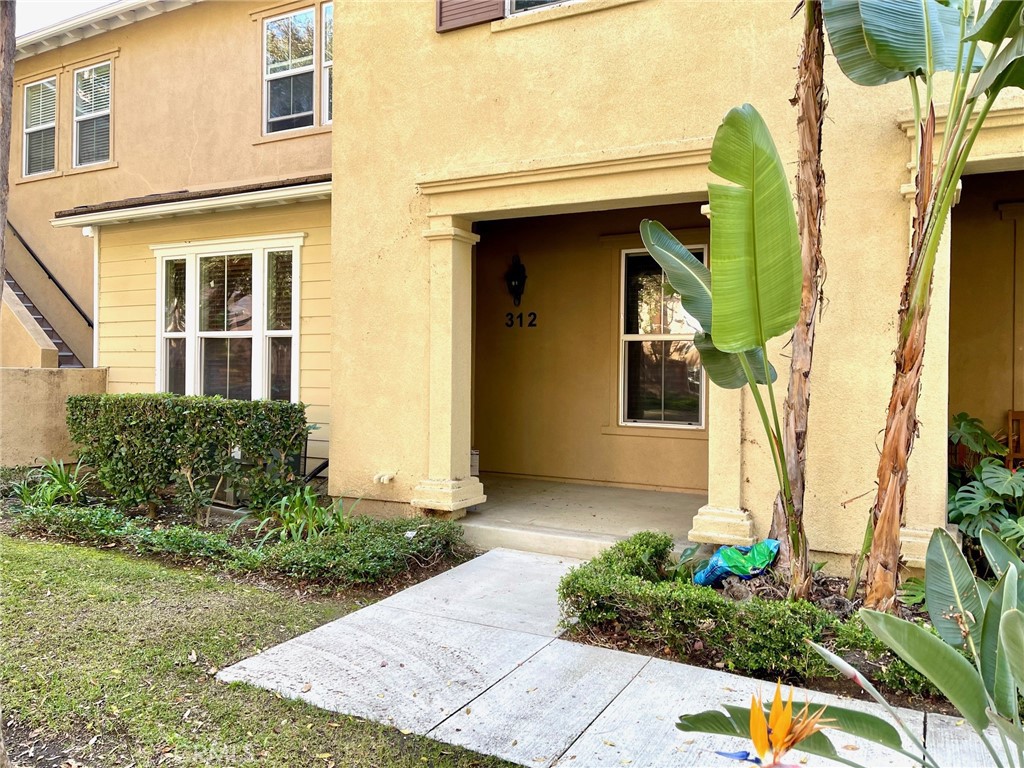 312 Quail Ridge Irvine, CA 92603 - Photo 1 of 35 a front view of a house with garden
