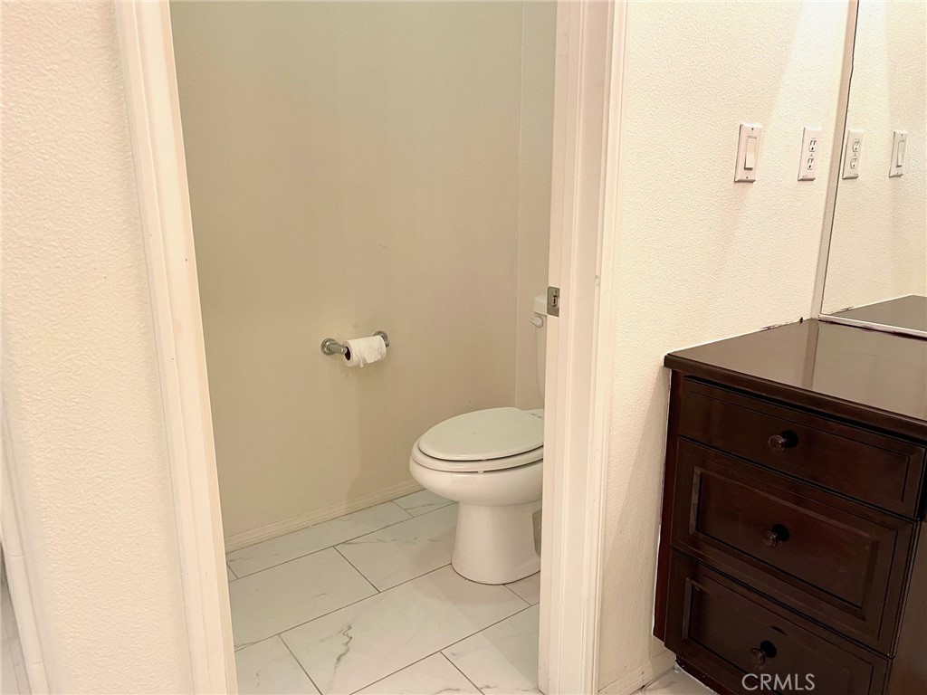 312 Quail Ridge Irvine, CA 92603 - Photo 15 of 35 a bathroom with a toilet and a sink