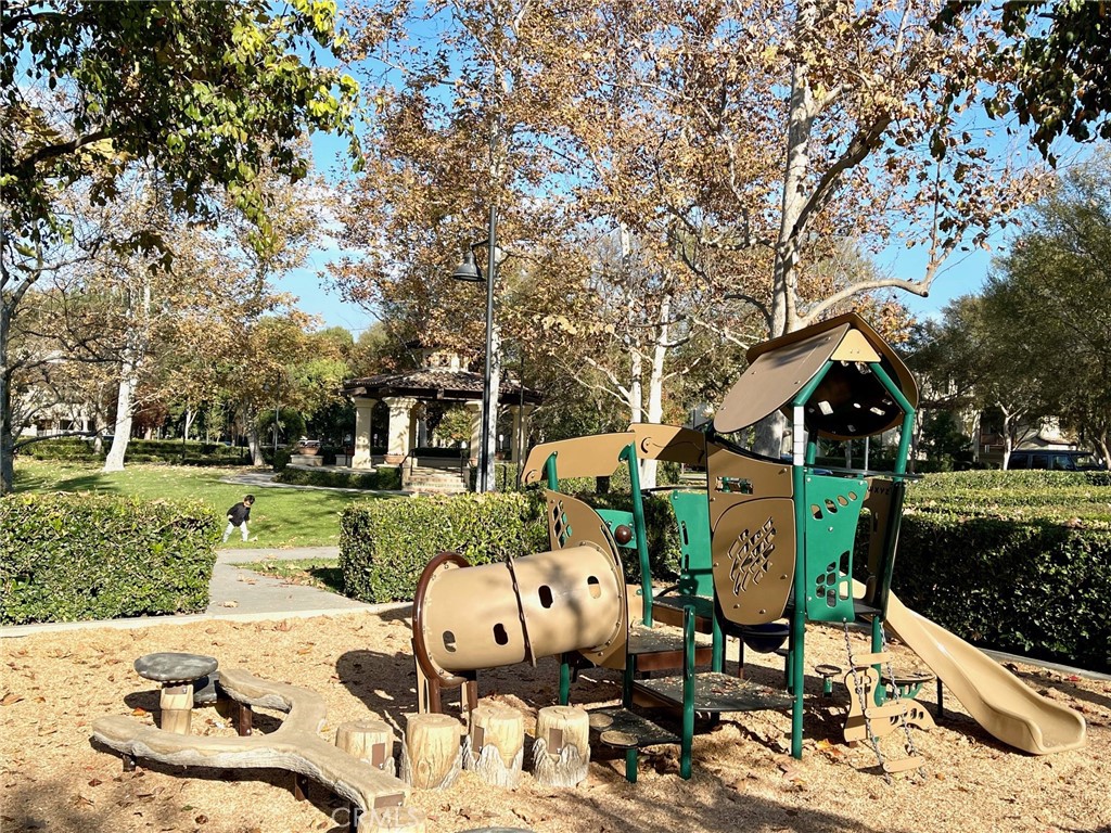312 Quail Ridge Irvine, CA 92603 - Photo 24 of 35 a view of backyard of house with seating space