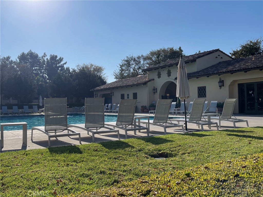 312 Quail Ridge Irvine, CA 92603 - Photo 30 of 35 a front view of a house with garden and trees