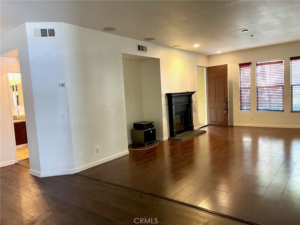 312 Quail Ridge Irvine, CA 92603 - Photo 6 of 35 a view of a livingroom with wooden floor