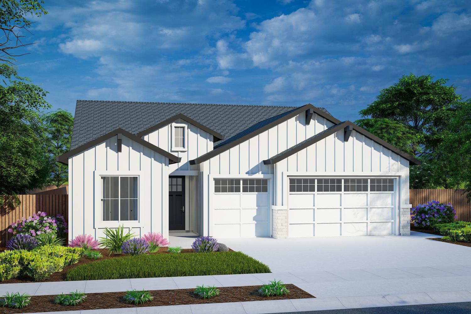 a front view of a house with a garden and plants