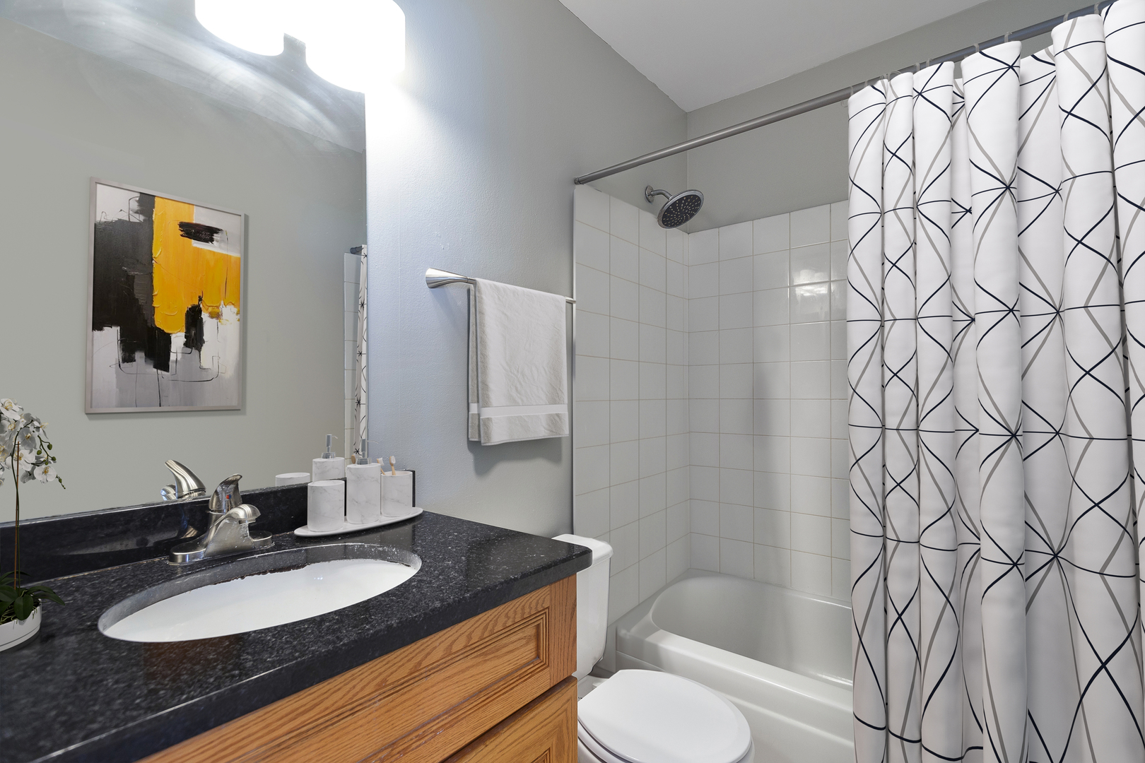 438 Harvard Lane Bartlett, IL 60103 - Photo 14 of 26 a bathroom with a granite countertop sink and a mirror with toilet