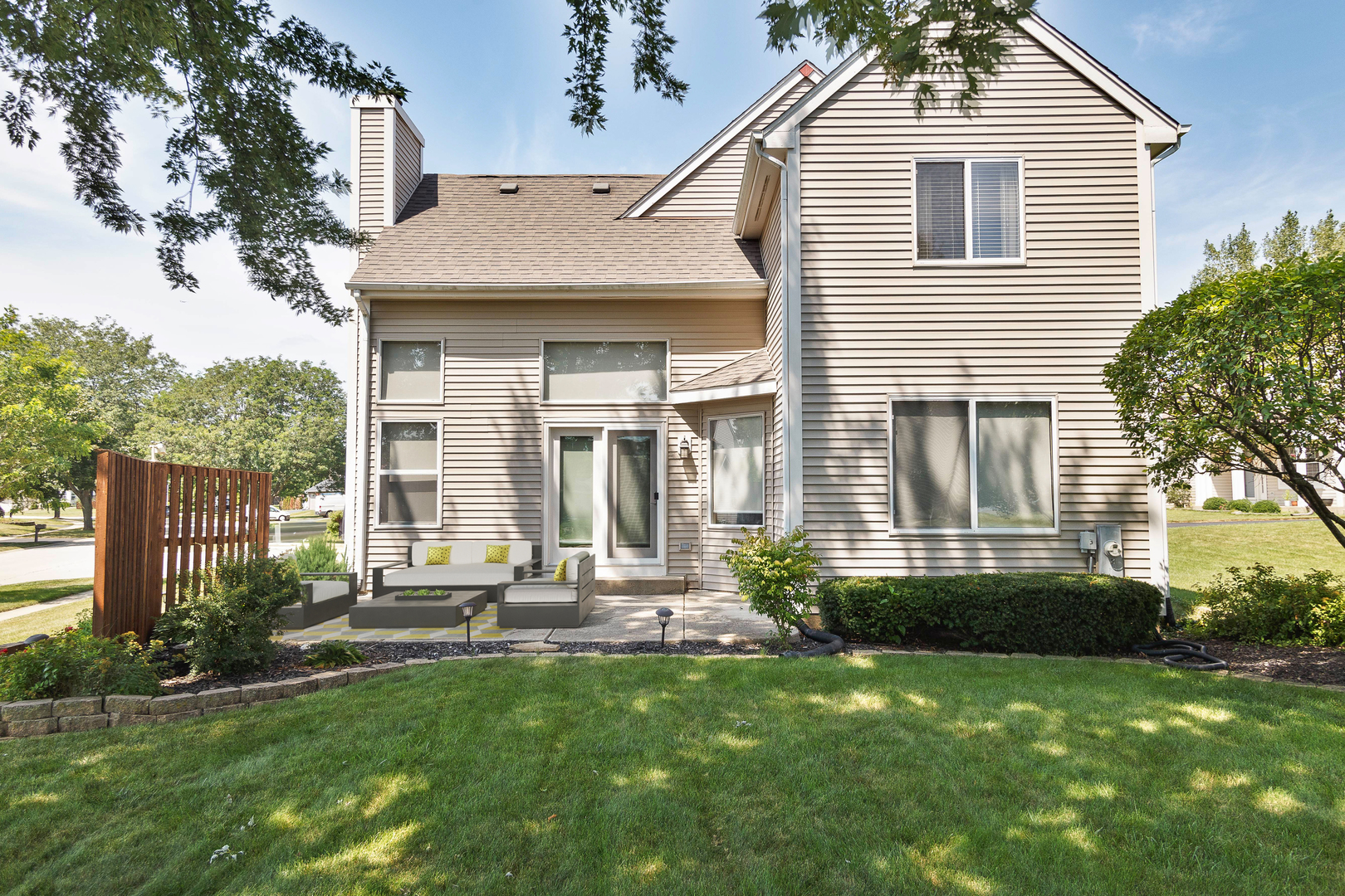 438 Harvard Lane Bartlett, IL 60103 - Photo 19 of 26 a front view of a house with a yard and outdoor seating