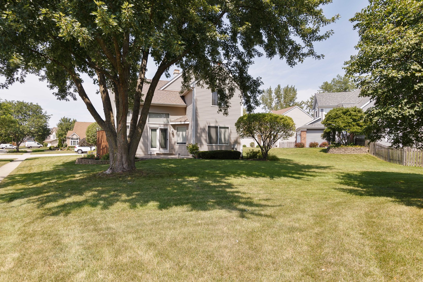 438 Harvard Lane Bartlett, IL 60103 - Photo 21 of 26 a view of a tree in front of a house