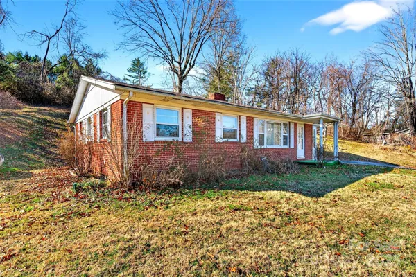 a backyard of a house with lots of green space