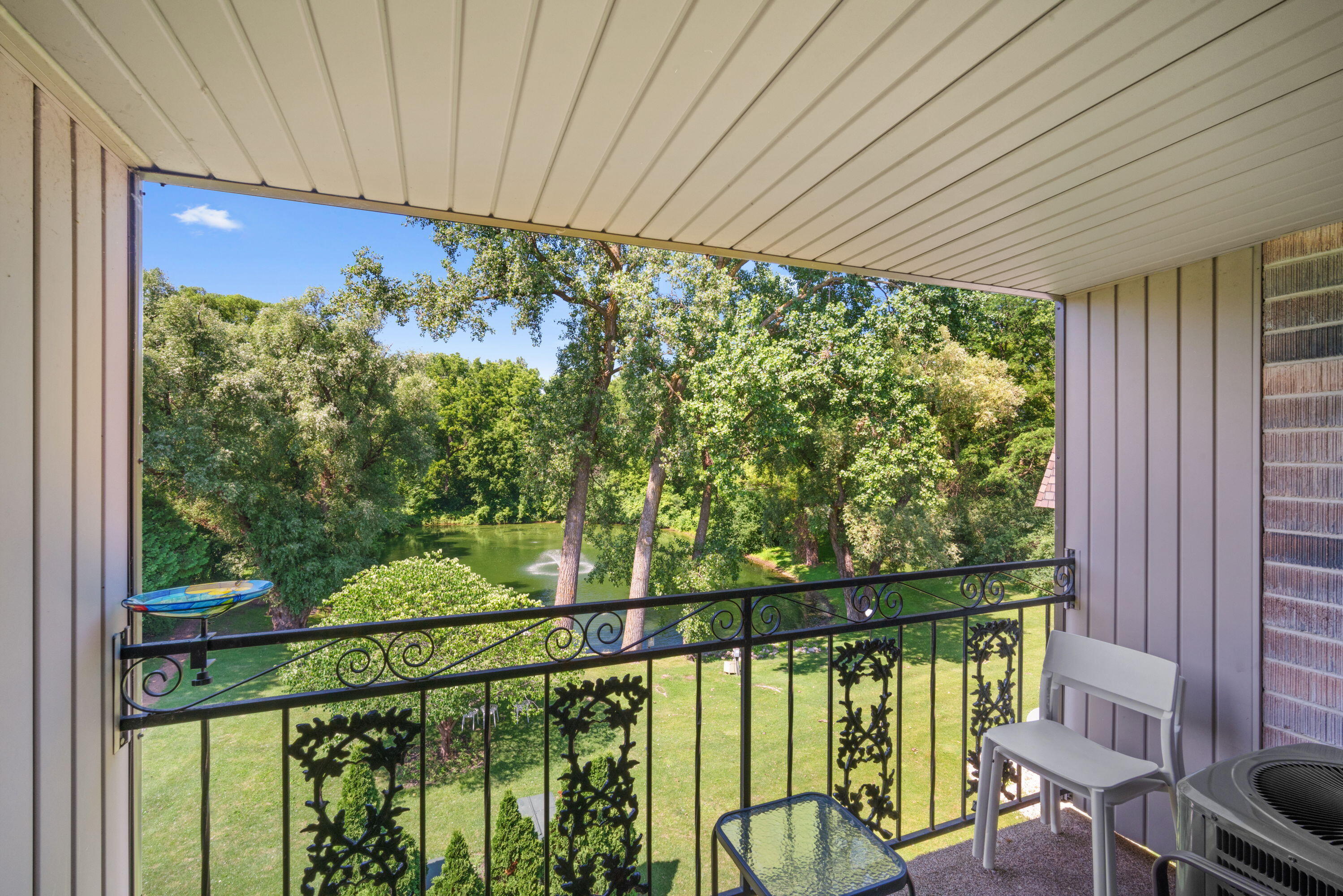 1730 West Green Tree Road, Unit 304 Glendale, WI 53209 - Photo 1 of 1 view of pond from balcony