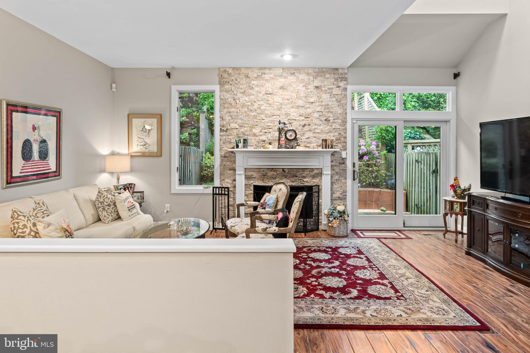 24 Greythorne Woods Circle Wayne, PA 19087 - Photo 12 of 29 a living room with furniture fireplace and flat screen tv