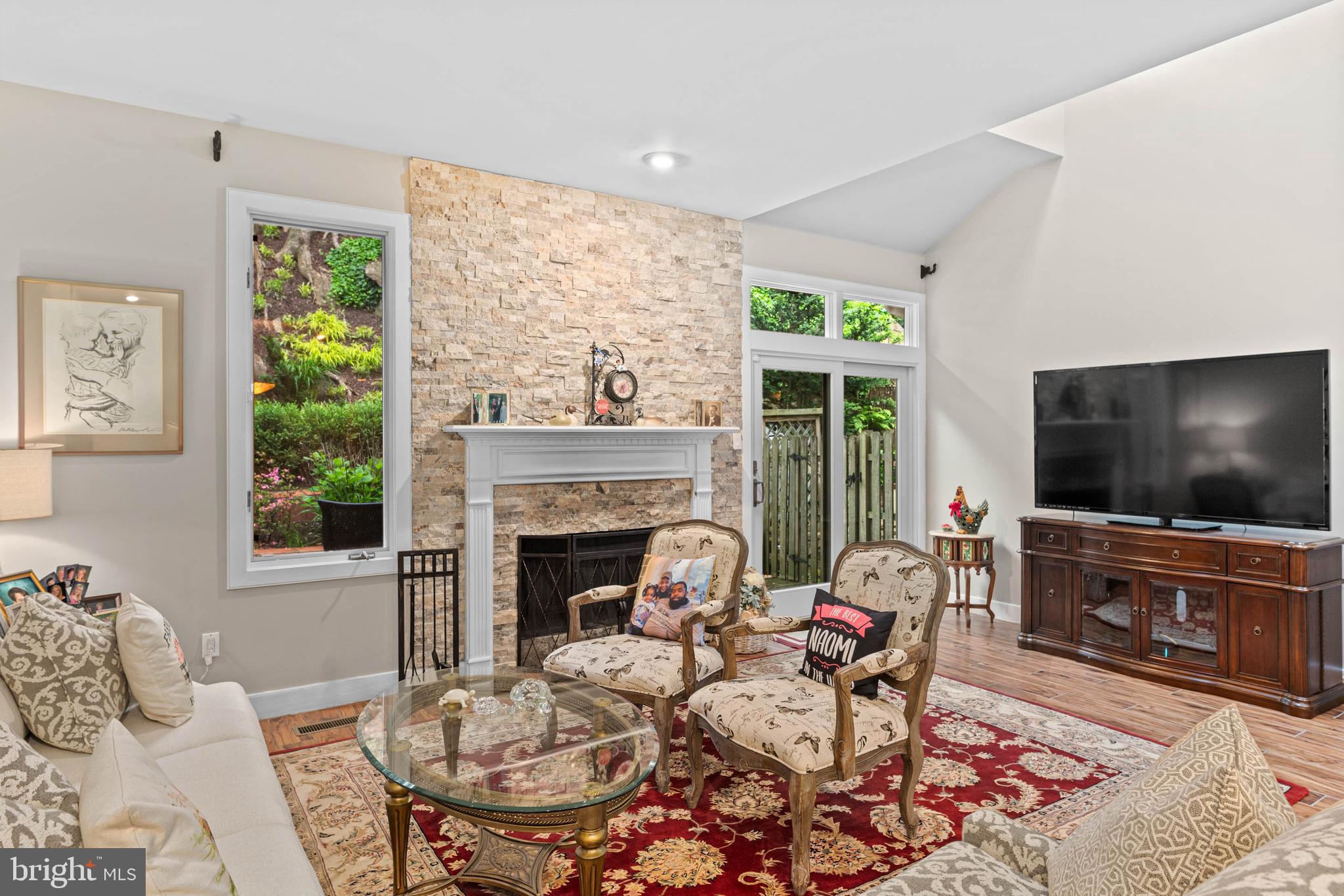 24 Greythorne Woods Circle Wayne, PA 19087 - Photo 13 of 29 a living room with furniture a flat screen tv and a fireplace