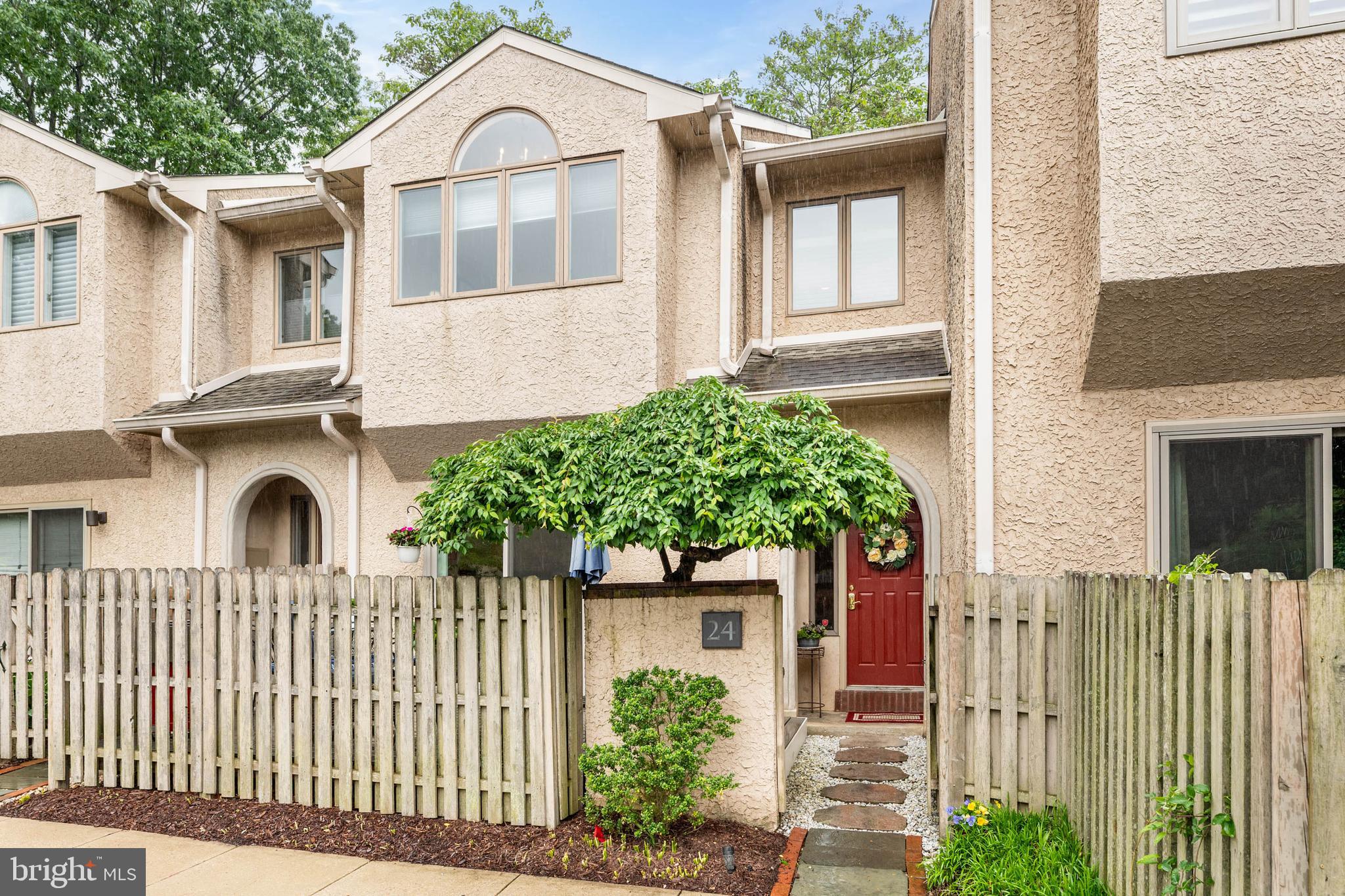 24 Greythorne Woods Circle Wayne, PA 19087 - Photo 2 of 29 a view of a white house with large windows