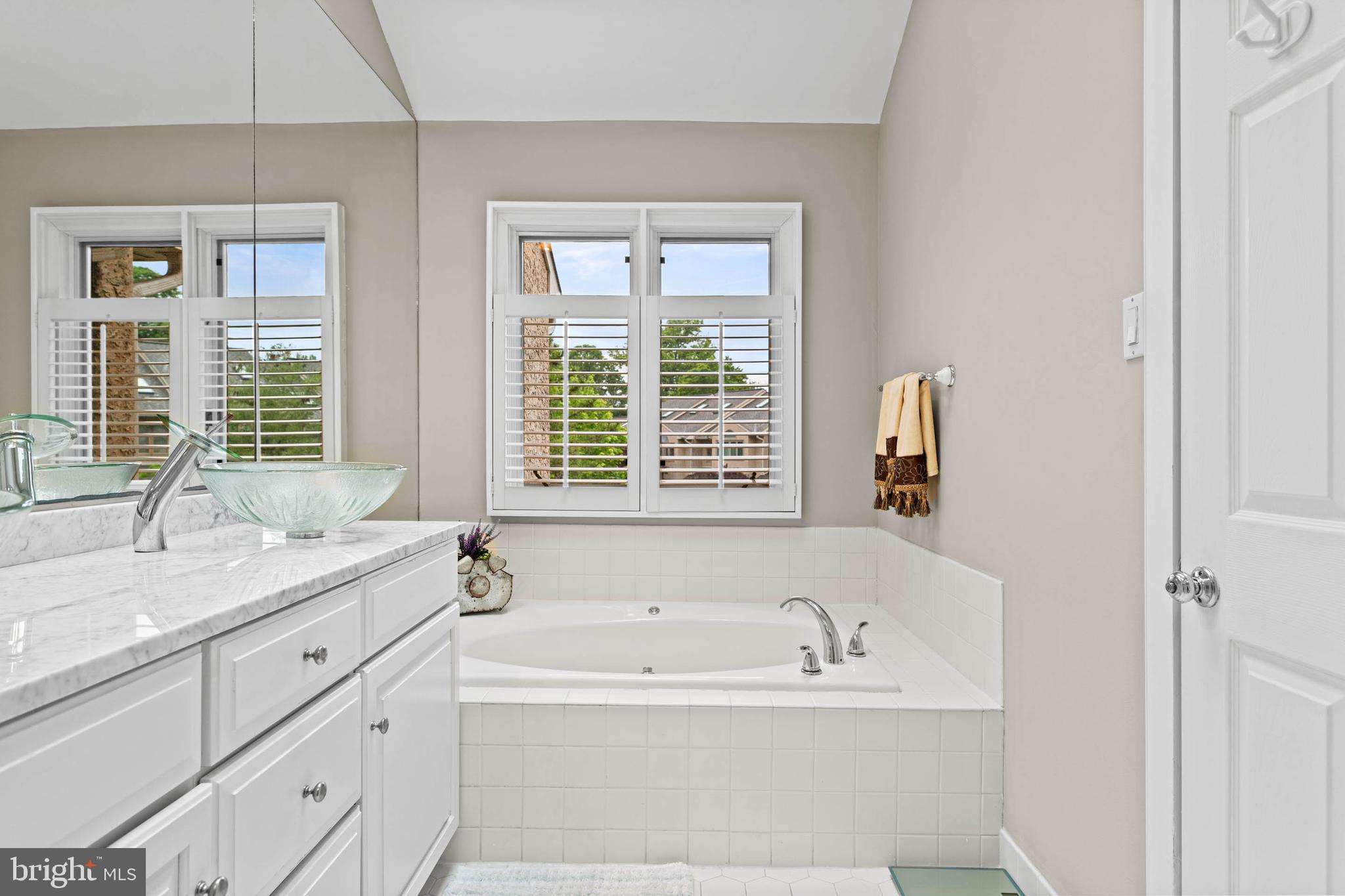 24 Greythorne Woods Circle Wayne, PA 19087 - Photo 23 of 29 a white bath tub sitting next to a window