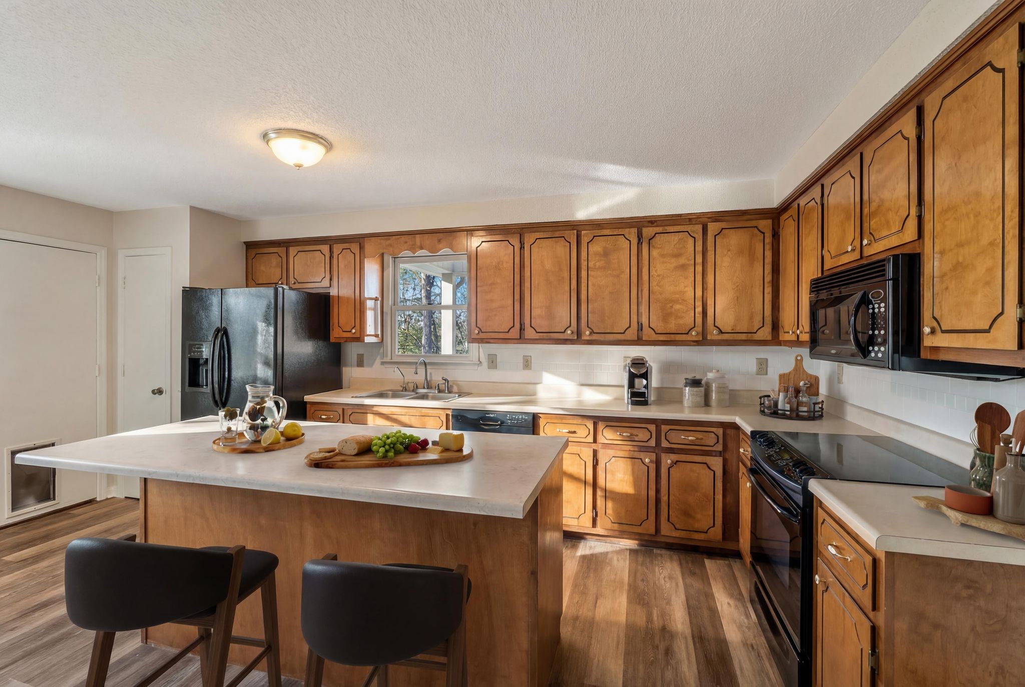 739 Salem Ridge Road Clarksville, TN 37040 - Photo 4 of 22 a kitchen with stainless steel appliances granite countertop a sink stove and refrigerator with wooden floor