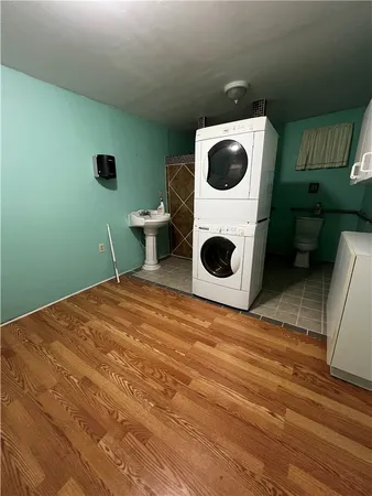 a bedroom with a washer and dryer