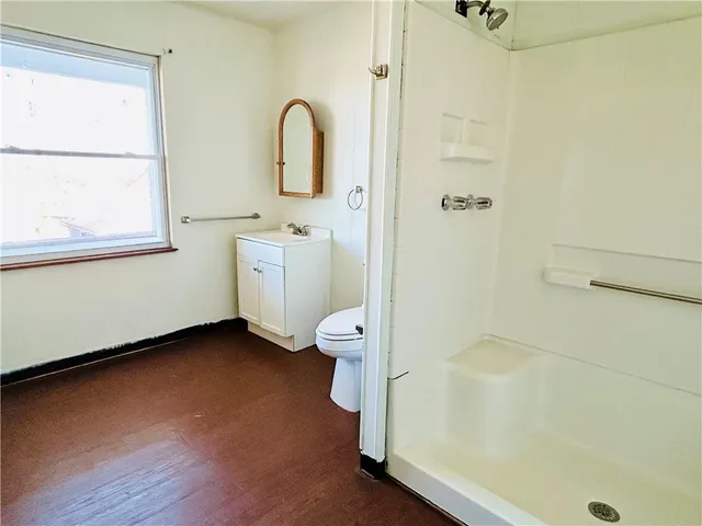 a bathroom with a granite countertop sink and vanity