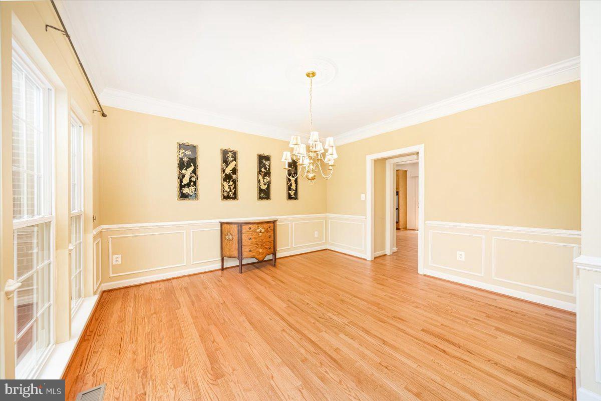 15205 Lions Den Road Burtonsville, MD 20866 - Photo 11 of 31 a view of a room with wooden floor and windows